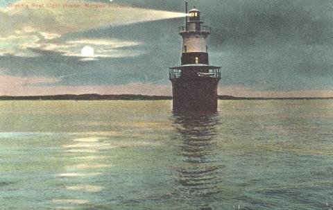 lighthouse illuminates the night