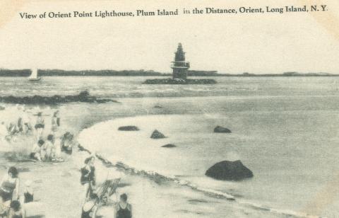 people in old fashioned swimwear on beach across from lighthouse