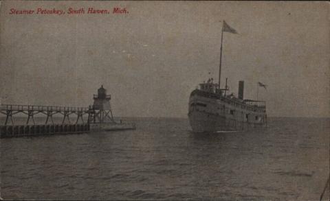 ship passes lighthouse