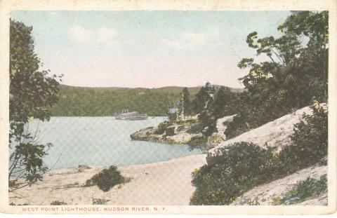 a ship passes the lighthouse