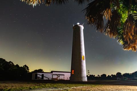 illuminated lighthouse at night