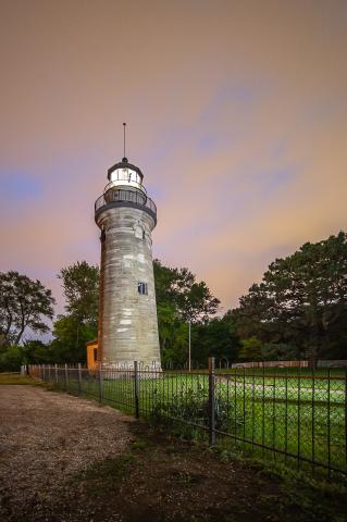 iron fence separated lighthouse ground from playground