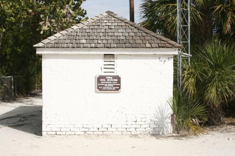 oil house with restoration sign