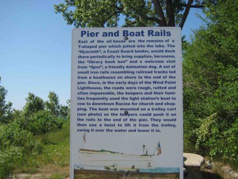 sign with details about the pier and boat ramp