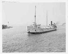 large ship passes the light station