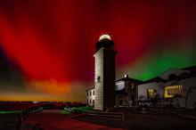 aurora borealis behind the lighthouse