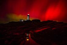aurora borealis behind the lighthouse
