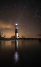 reflection of the lighthouse in the water