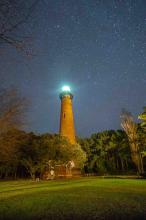 lighthouse illuminated at night