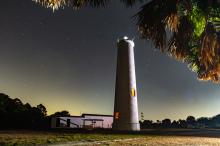 illuminated lighthouse at night