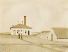 2 men on the pathway to the fog house