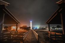 station at night as seen from end of boardwalk