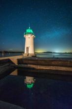 reflection of the lighthouse in the water