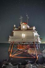 lights on in the lighthouse at night