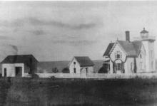 barn on left of station